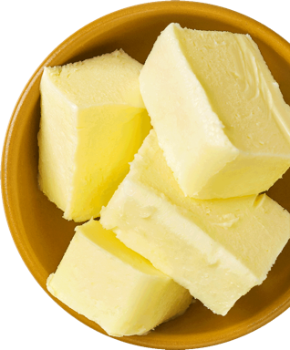 Slices of butter in a brown bowl