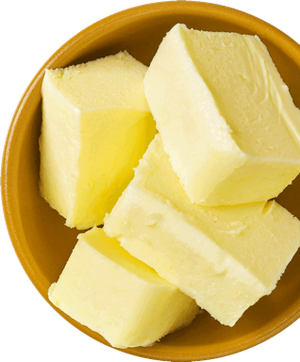 Slices of butter in a brown bowl