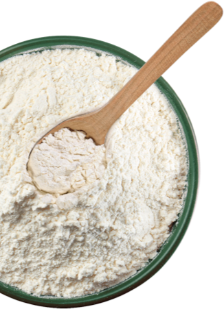 Flour in a green bowl with a wooden spoon